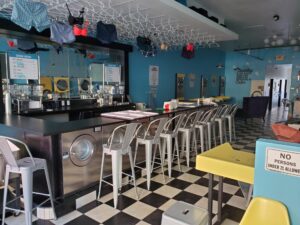 Cheap Shot Bar - bar with chairs, black and white tiles